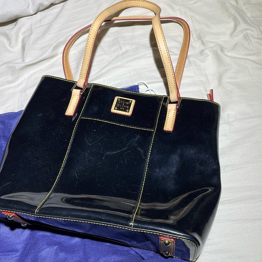 Dooney & Bourke black patent leather never used.